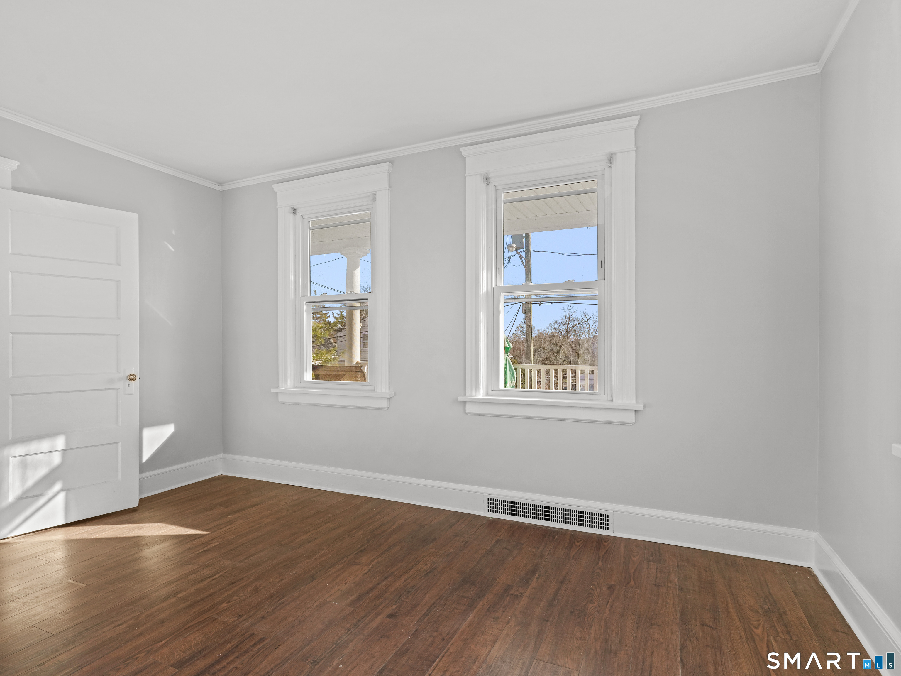 20 Cerretta Street Stamford, CT 06907 - Photo 11 of 22 a view of an empty room with wooden floor and a window