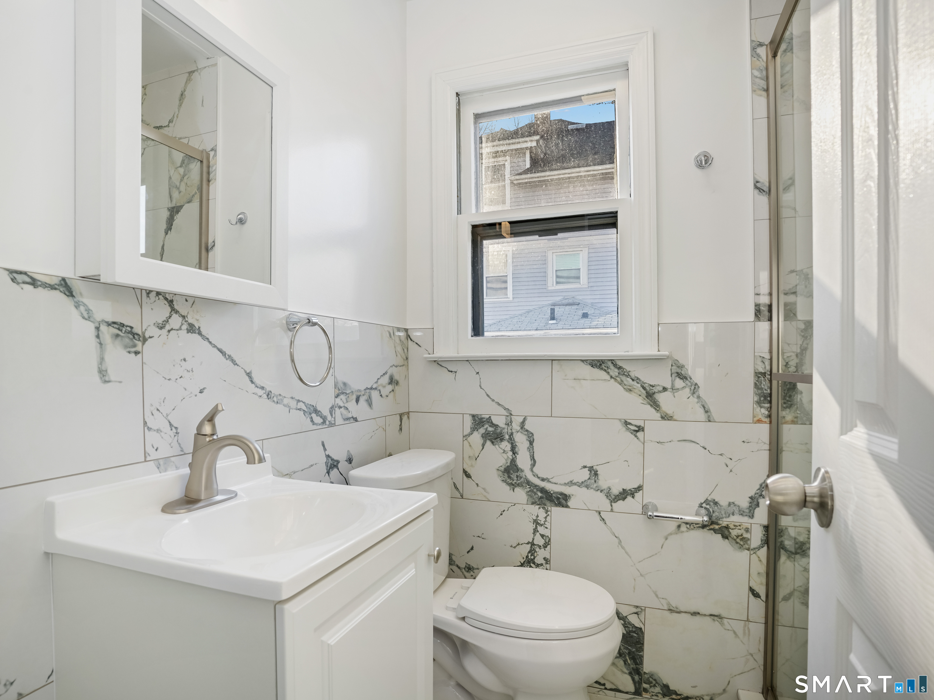 20 Cerretta Street Stamford, CT 06907 - Photo 13 of 22 a bathroom with a sink toilet and a mirror