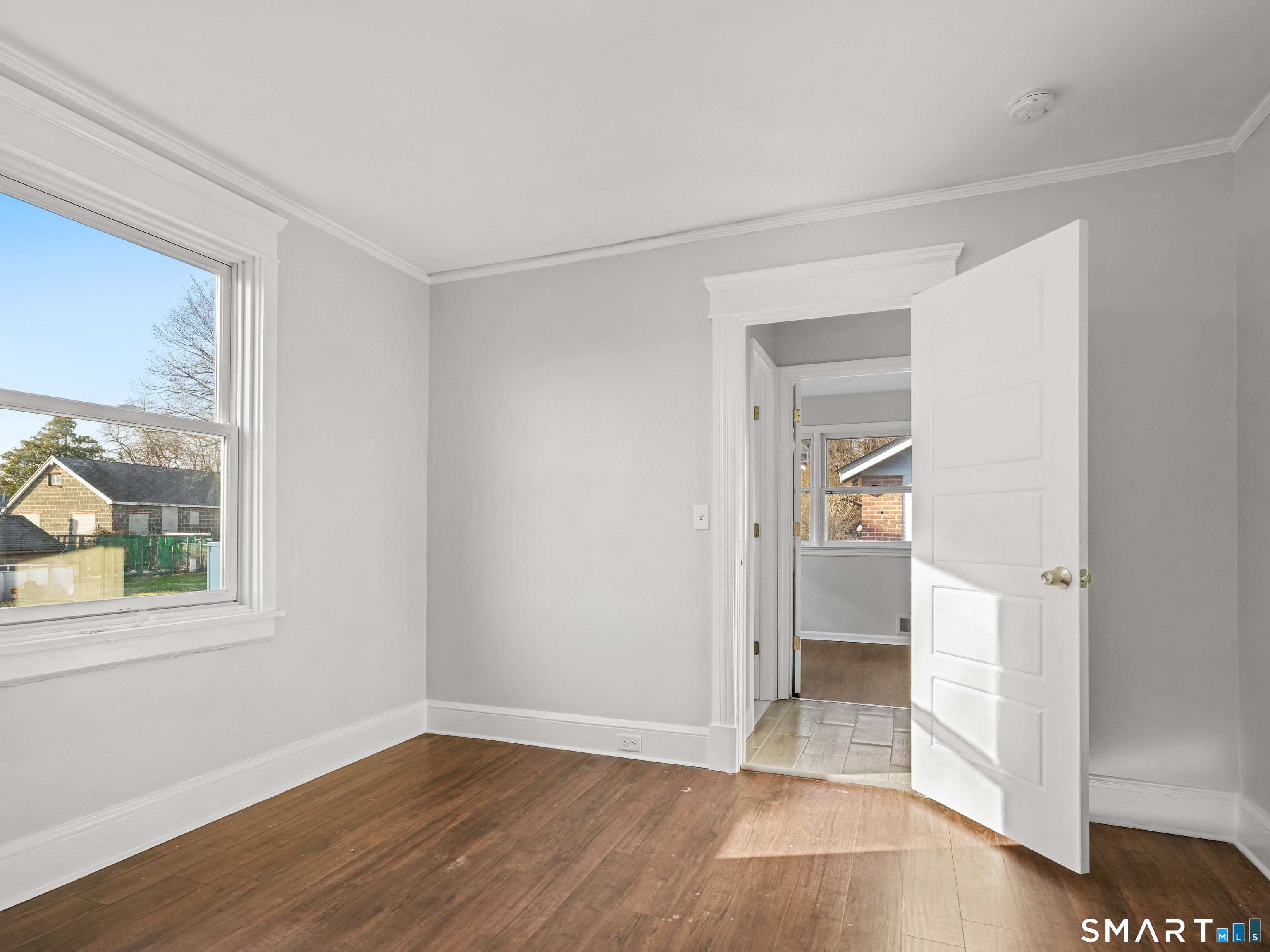 20 Cerretta Street Stamford, CT 06907 - Photo 14 of 22 an empty room with wooden floor and windows