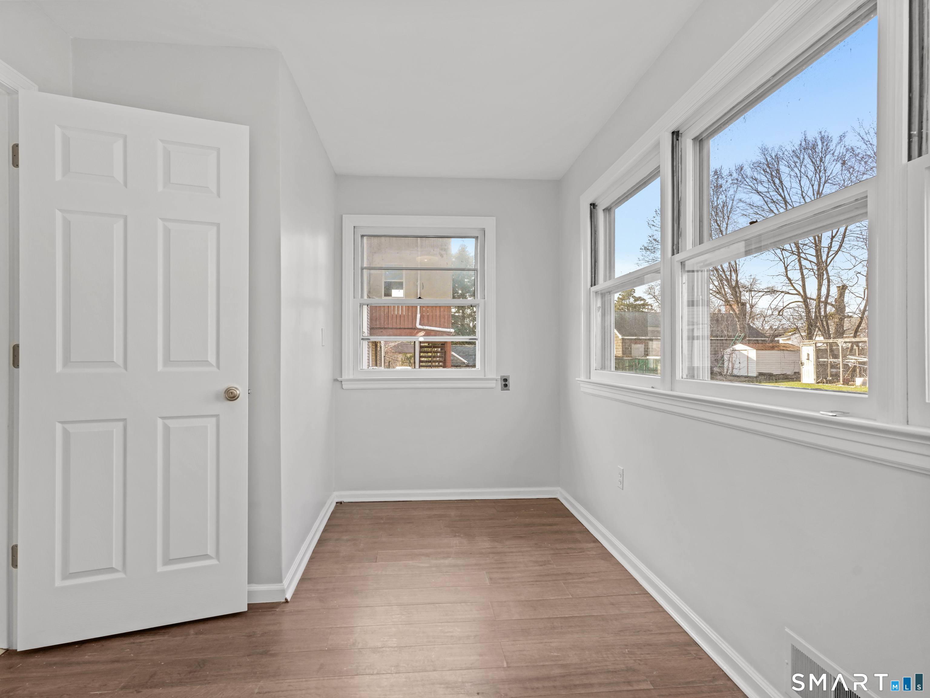 20 Cerretta Street Stamford, CT 06907 - Photo 16 of 22 a view of an empty room with wooden floor and a window