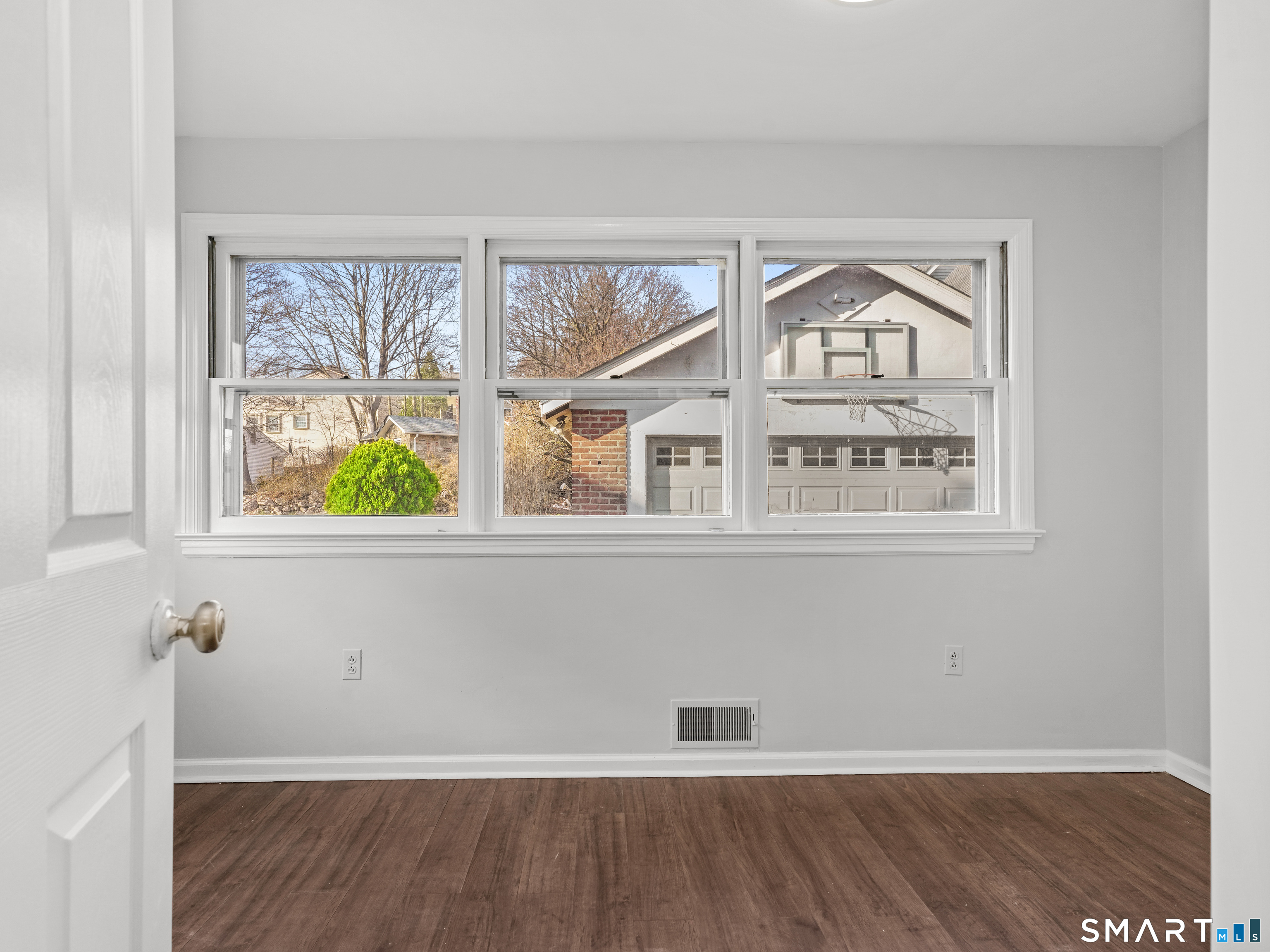 20 Cerretta Street Stamford, CT 06907 - Photo 18 of 22 a view of an empty room with wooden floor and a window