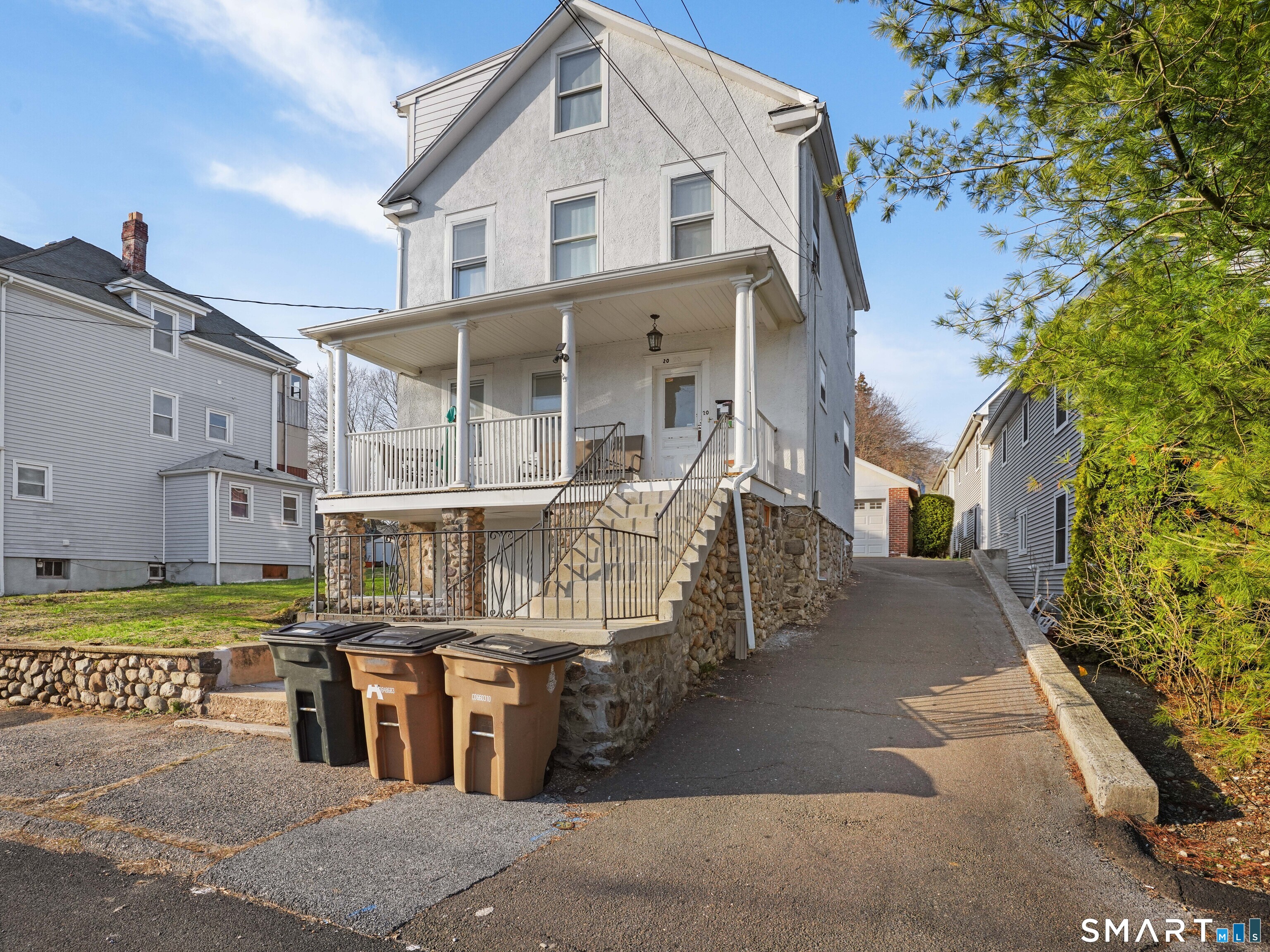 20 Cerretta Street Stamford, CT 06907 - Photo 2 of 22 a view of a white building with a large tree