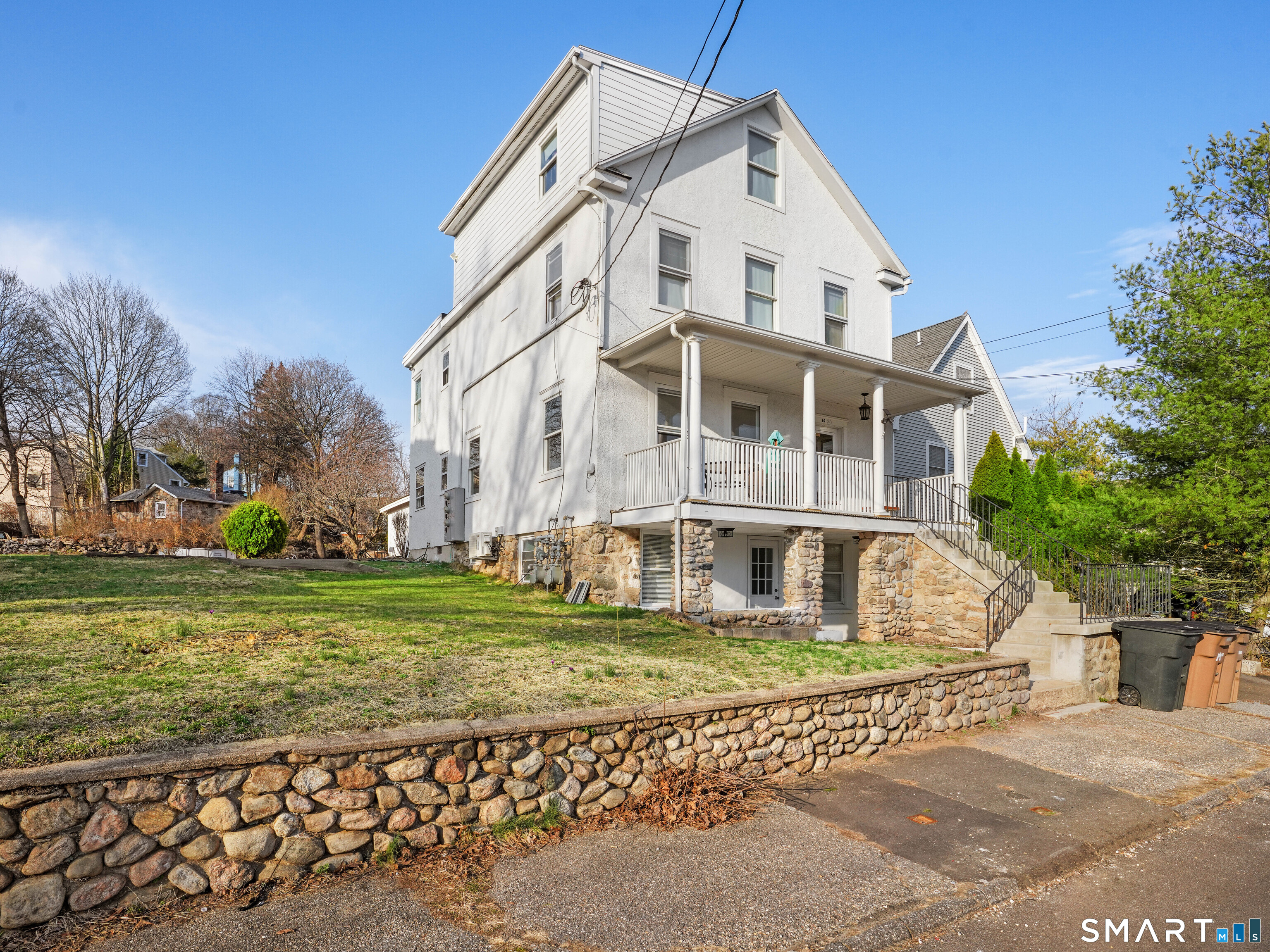 20 Cerretta Street Stamford, CT 06907 - Photo 3 of 22 a front view of a house with a yard