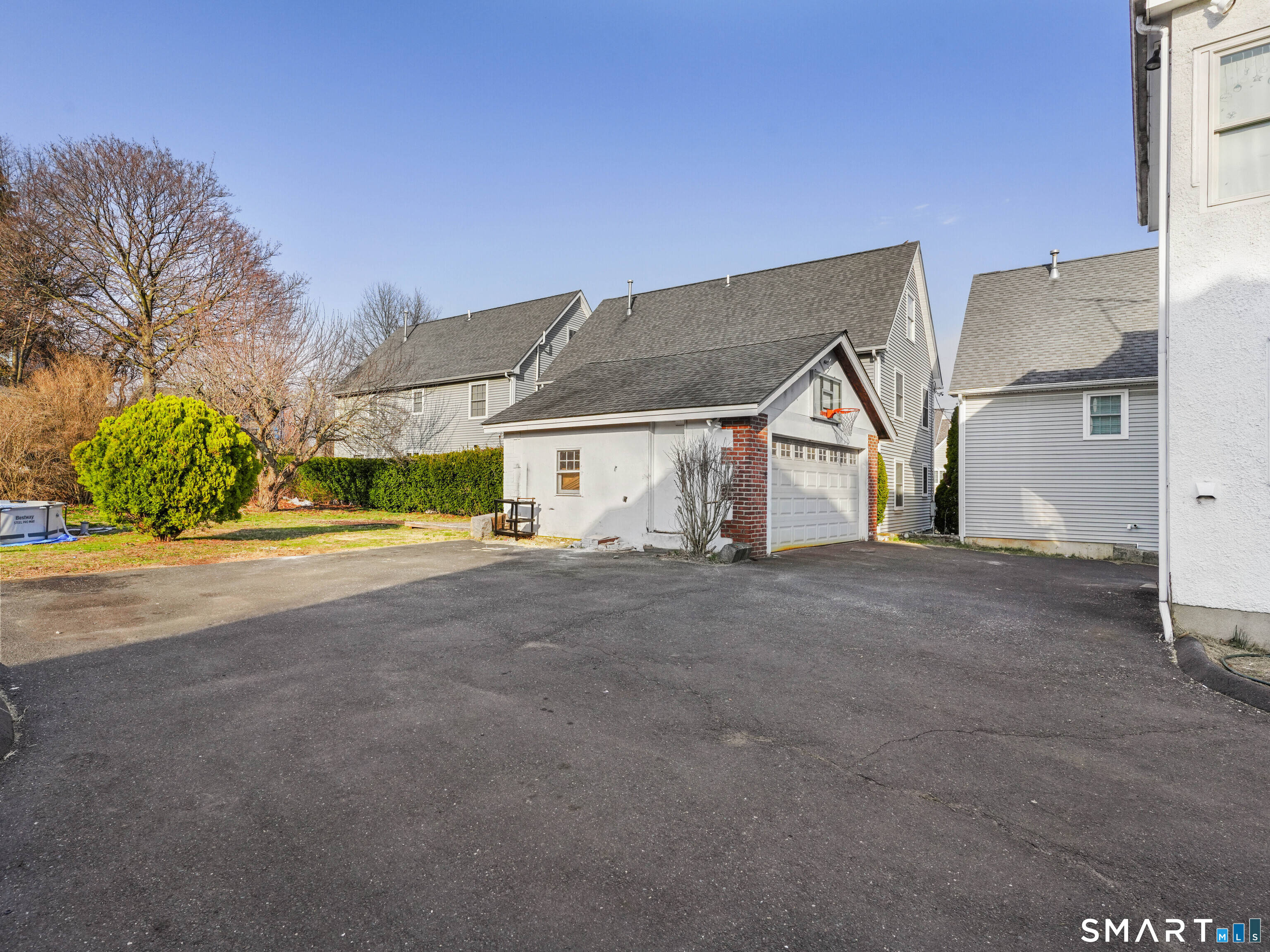 20 Cerretta Street Stamford, CT 06907 - Photo 5 of 22 a view of a house with a yard and garage