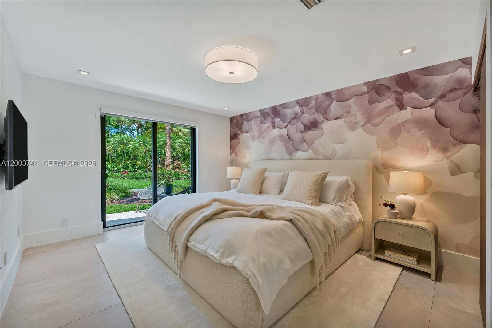 2675 Hackney Road Weston, FL 33331 - Photo 49 of 61 a bed sitting in a bedroom next to a window