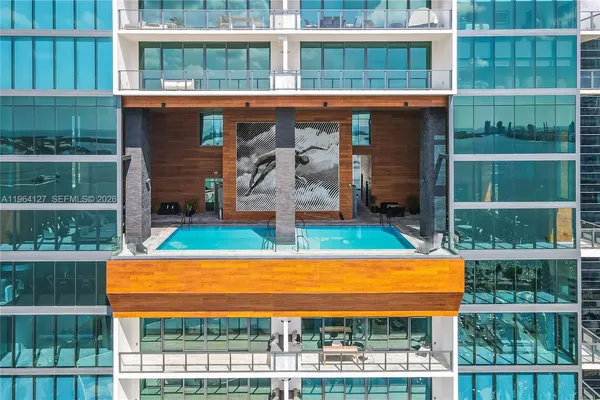 a view of swimming pool from a balcony
