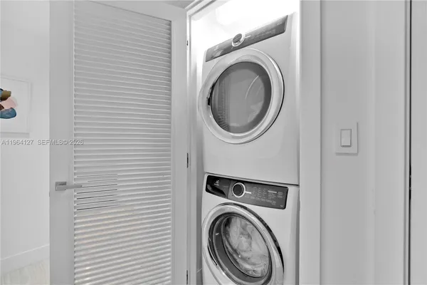 a view of a storage & utility room with washer and dryer