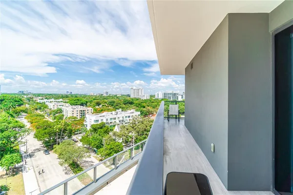 a view of a balcony with an outdoor space
