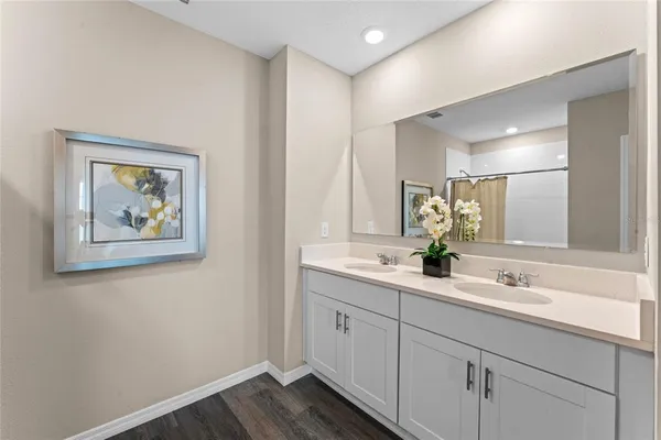 a bathroom with 2 sink and a mirror