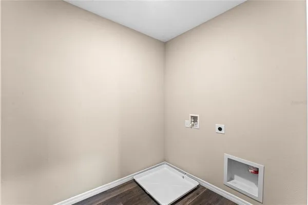 a bathroom with a sink toilet a mirror and shower
