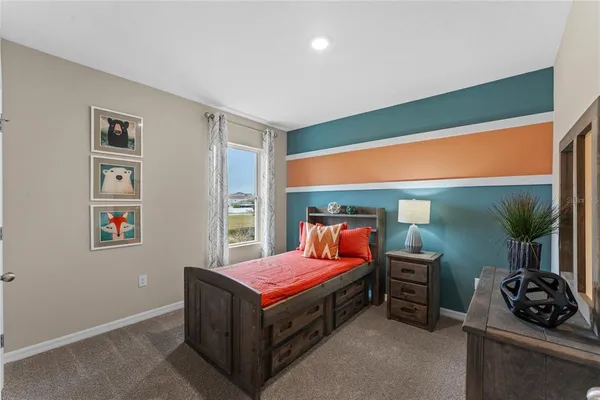 a bedroom with a bed and a table in it