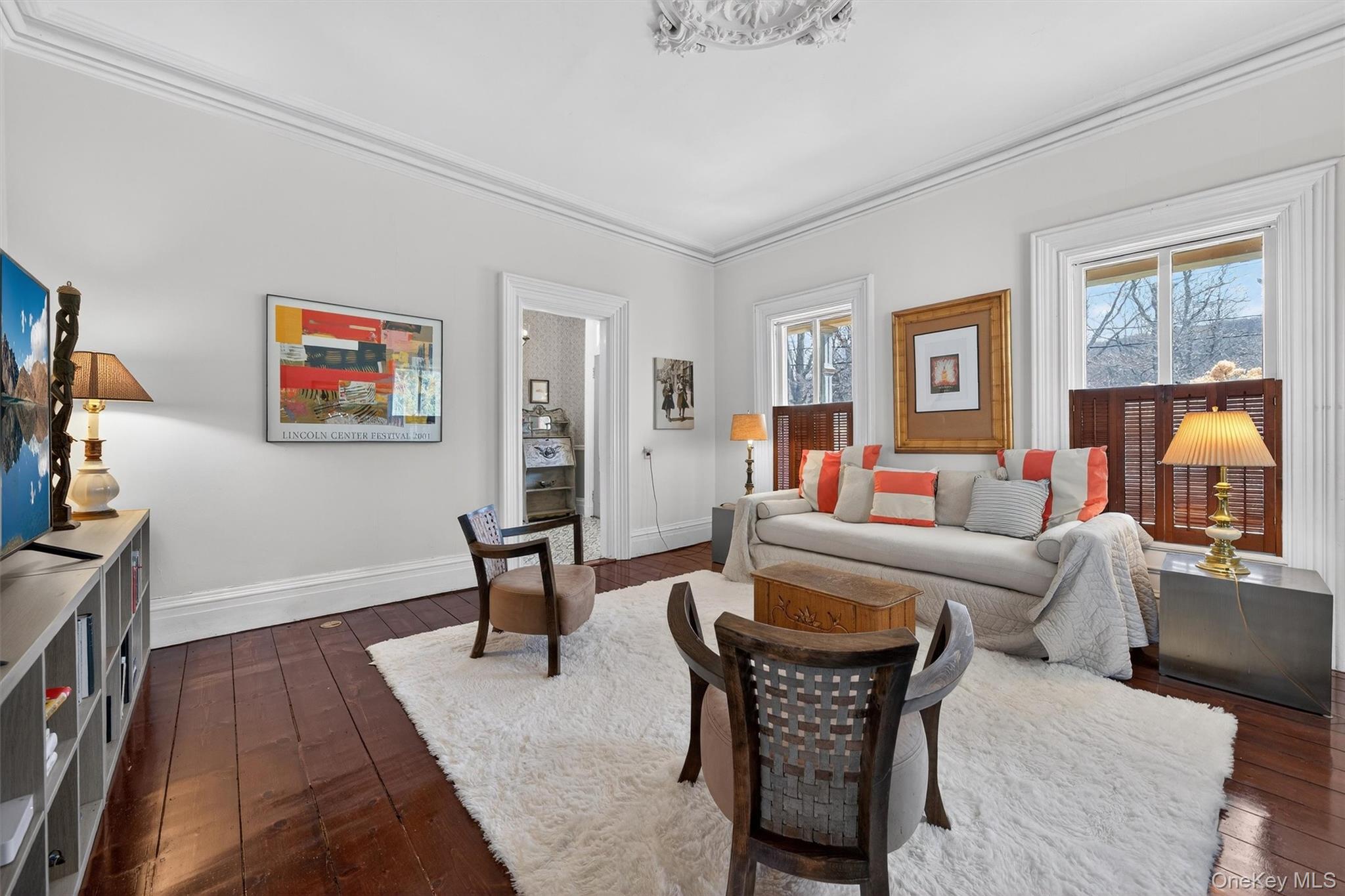 315 Bellvale Lakes Road Warwick, NY 10990 - Photo 49 of 50 a living room with furniture two window and a flat screen tv