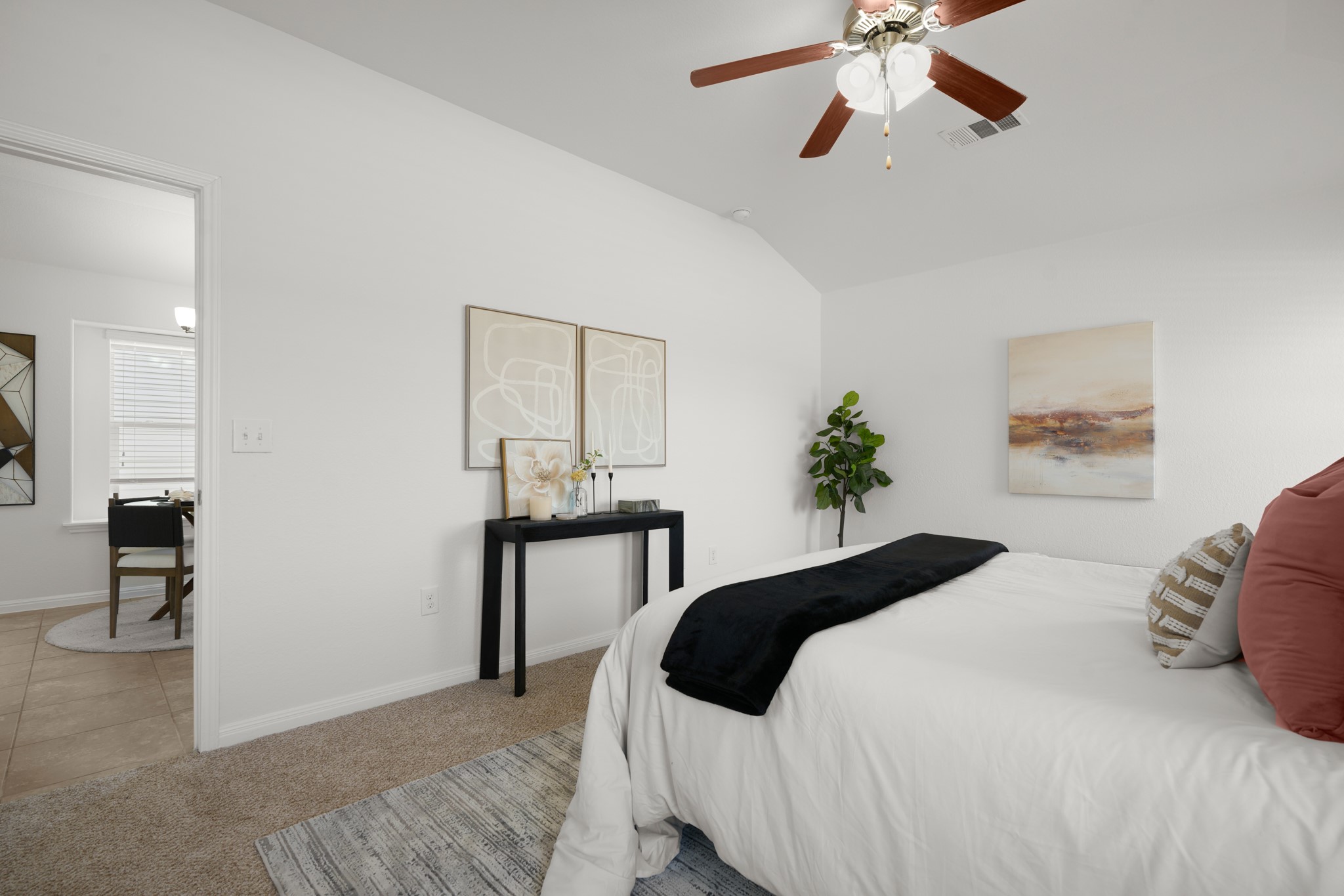 301 Cane River Road Pflugerville, TX 78660 - Photo 13 of 22 A comfortable bedroom features carpet flooring and a ceiling fan for optimal airflow.