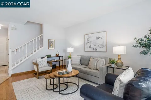 a living room with furniture and a table