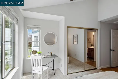 a work place with a window and a mirror