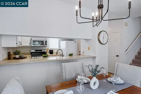 a kitchen with stainless steel appliances granite countertop a sink and cabinets