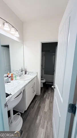 a bathroom with a sink and a mirror