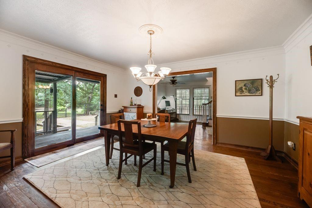 9875 Old Bridge Road Terrell, TX 75160 - Photo 17 of 40 a dining room with furniture a chandelier and wooden floor