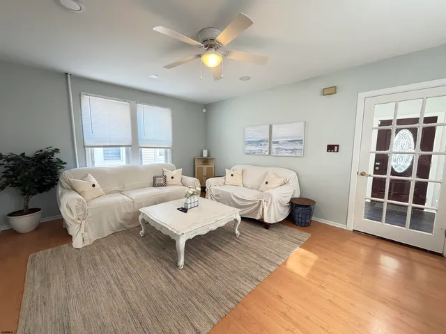 a spacious bedroom with a bed and a couch