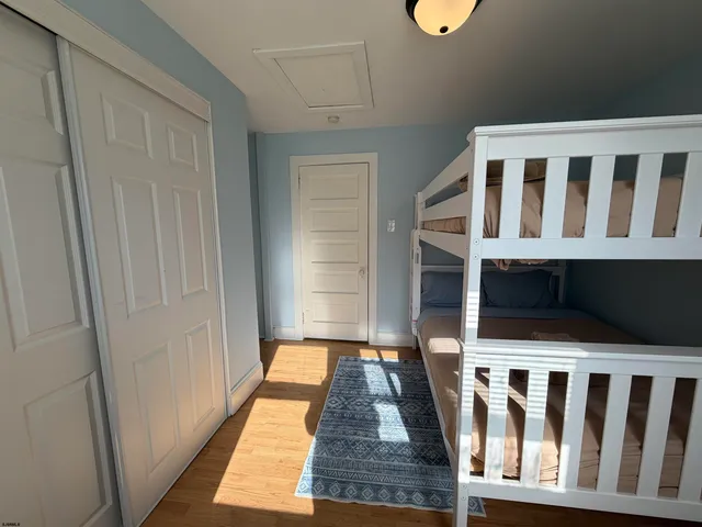 a bedroom with a bed and a chair