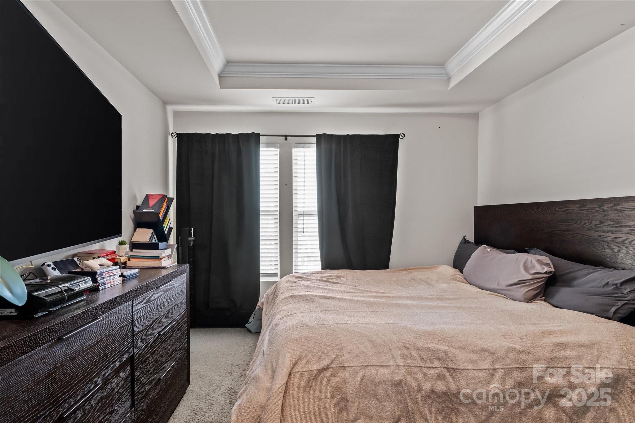 1564 Galloway Road Charlotte, NC 28262 - Photo 12 of 22 a bedroom with a bed and a dresser