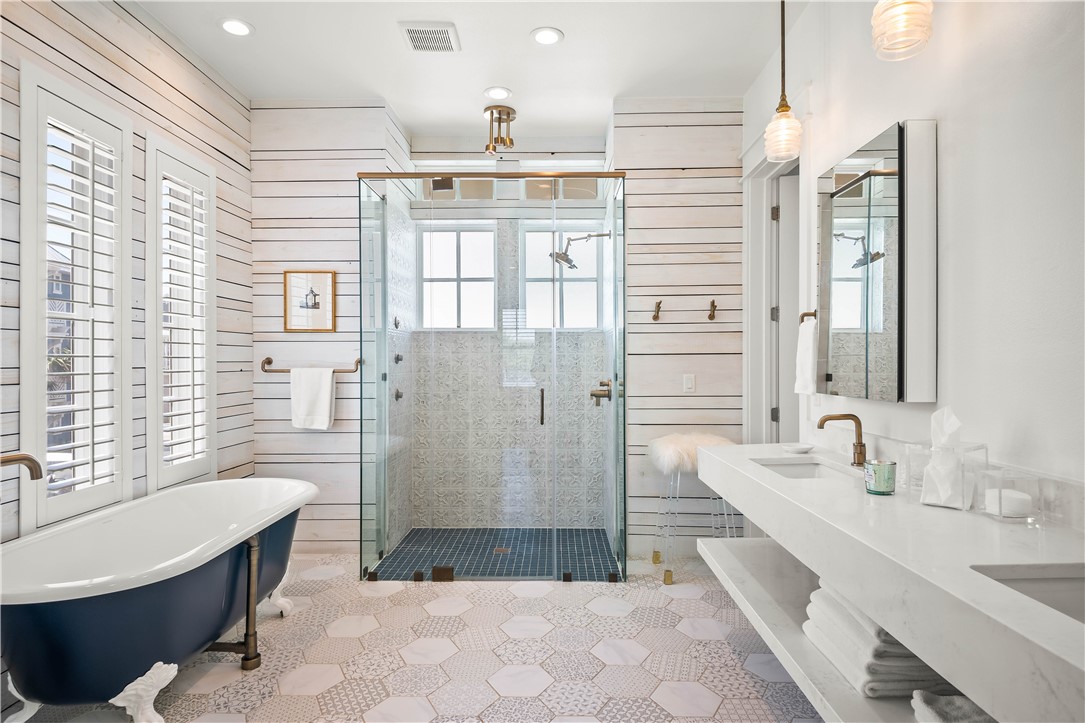 200 Round Road Port Aransas, TX 78373 - Photo 15 of 31 a bathroom with a granite countertop sink a bathtub and a shower