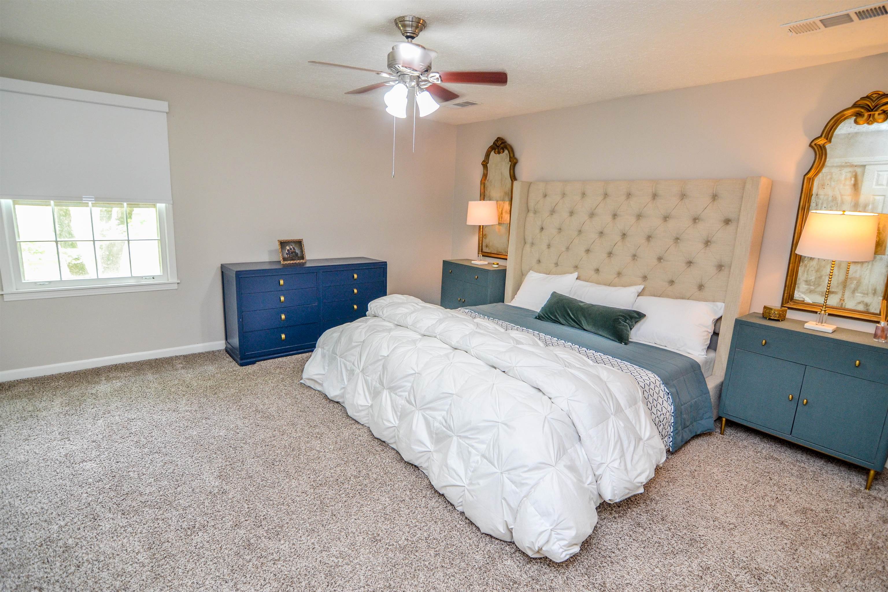 218 East Harpers Ferry Road Collierville, TN 38017 - Photo 12 of 25 a bedroom with a bed dresser and a window