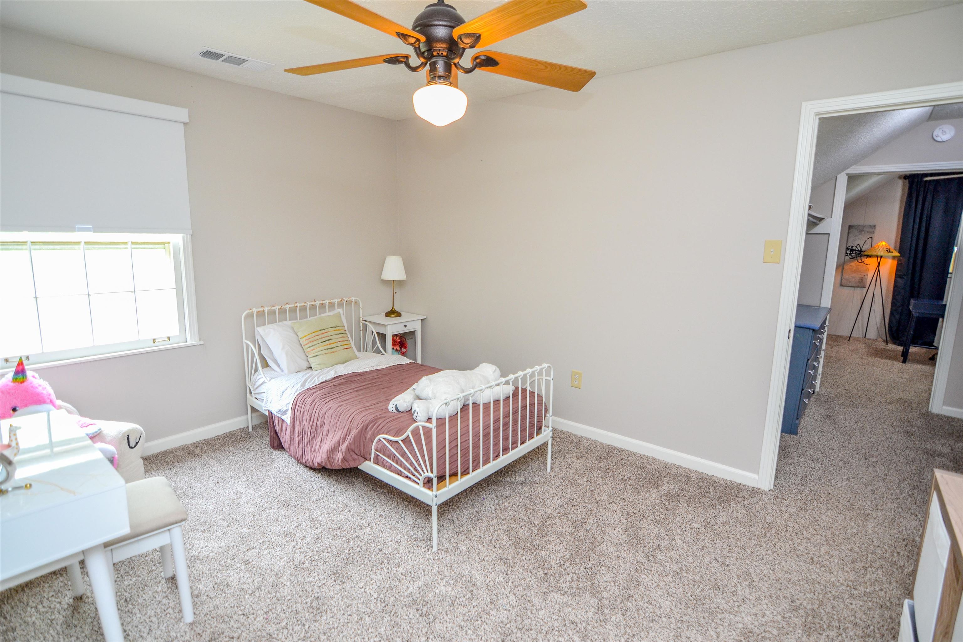 218 East Harpers Ferry Road Collierville, TN 38017 - Photo 16 of 25 a bedroom with a bed and a chandelier