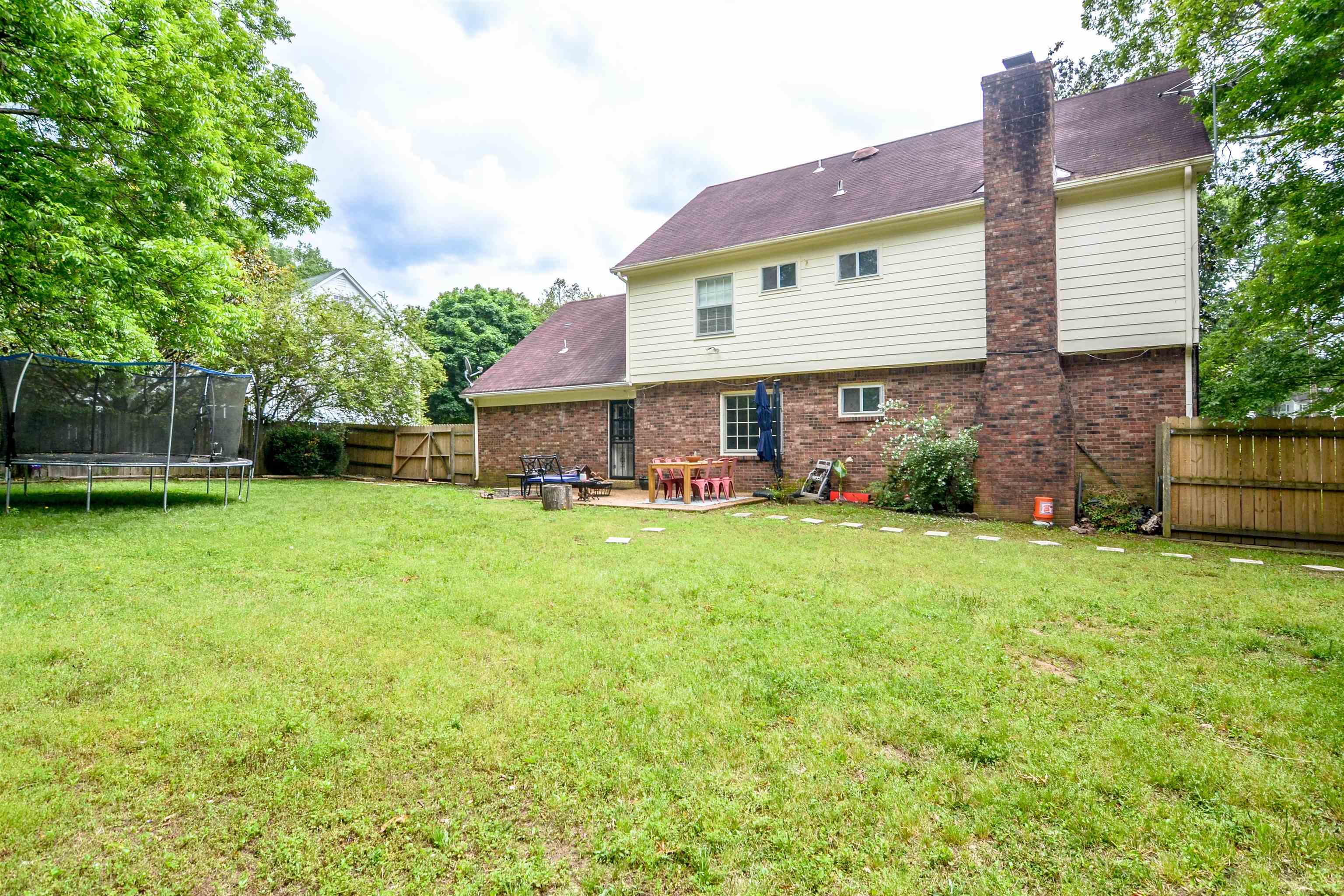 218 East Harpers Ferry Road Collierville, TN 38017 - Photo 25 of 25 a view of a house with backyard and a garden