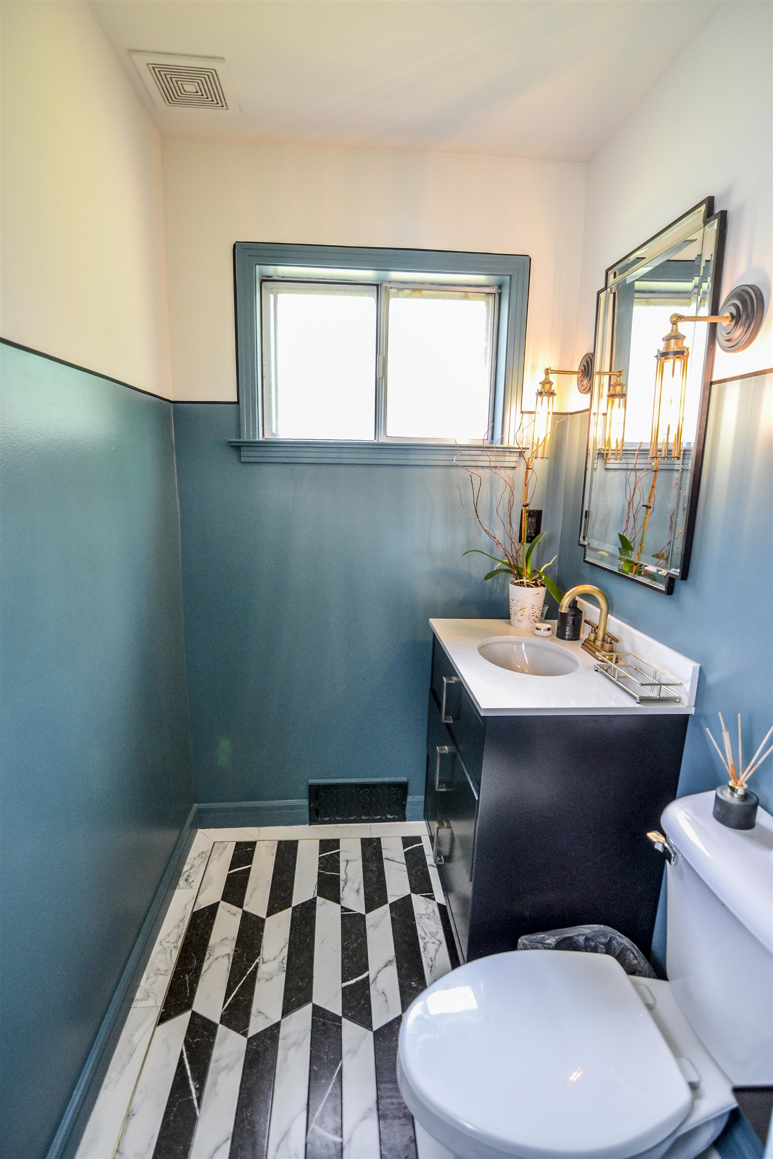 218 East Harpers Ferry Road Collierville, TN 38017 - Photo 7 of 25 a bathroom with a toilet a sink and mirror
