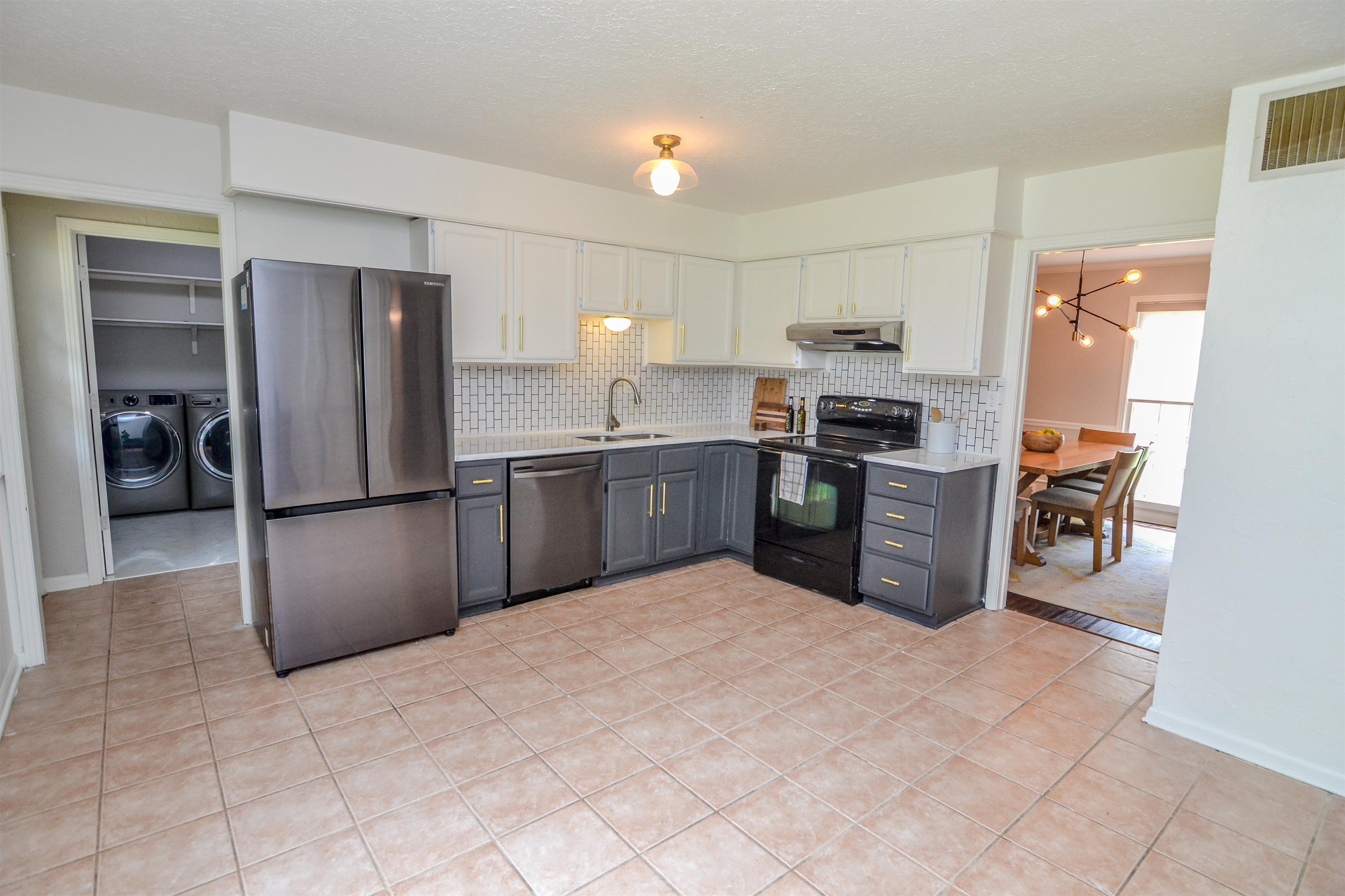 218 East Harpers Ferry Road Collierville, TN 38017 - Photo 8 of 25 a kitchen with stainless steel appliances granite countertop a refrigerator and a sink