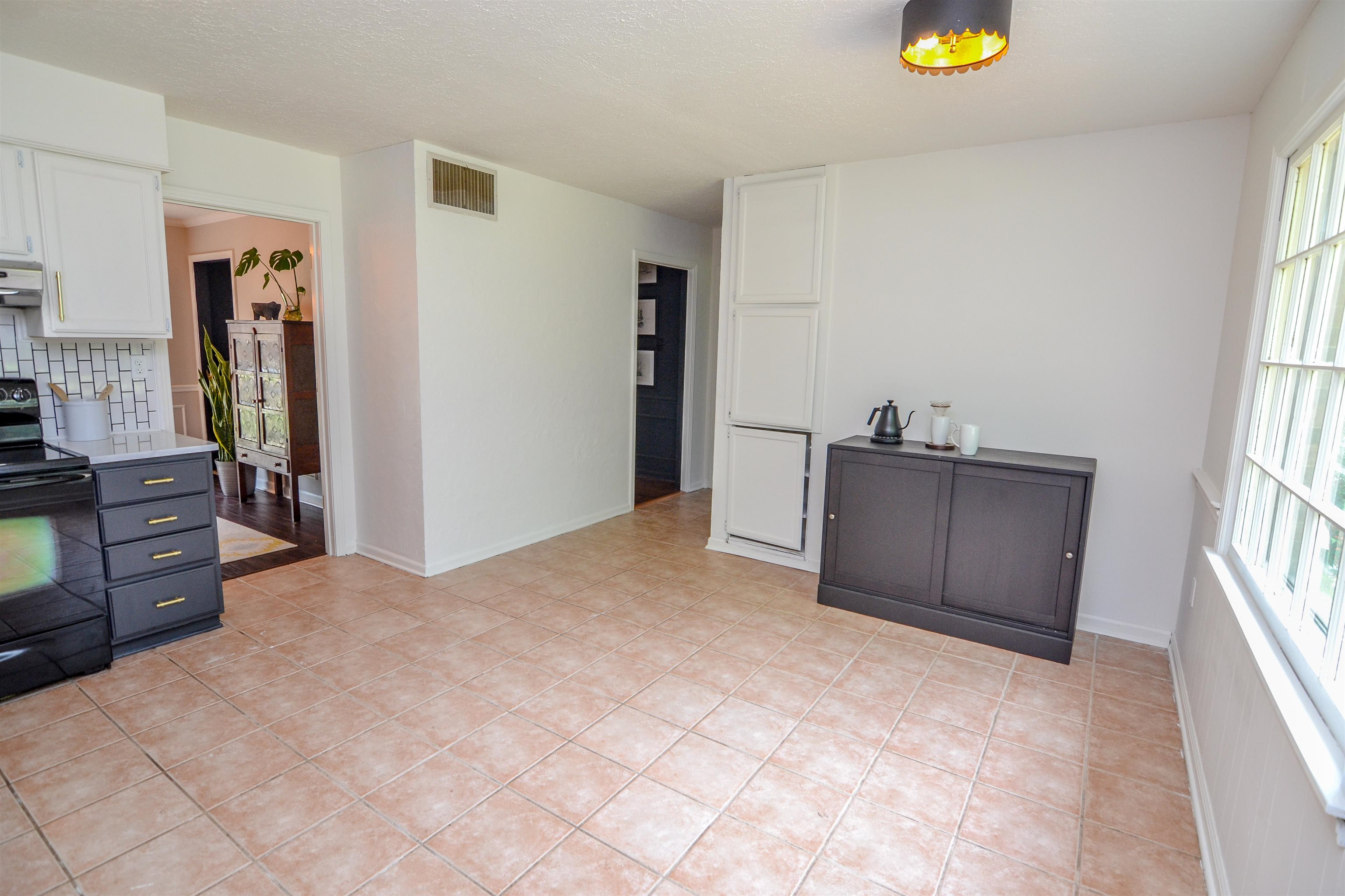 218 East Harpers Ferry Road Collierville, TN 38017 - Photo 10 of 25 a view of a kitchen with furniture and a window