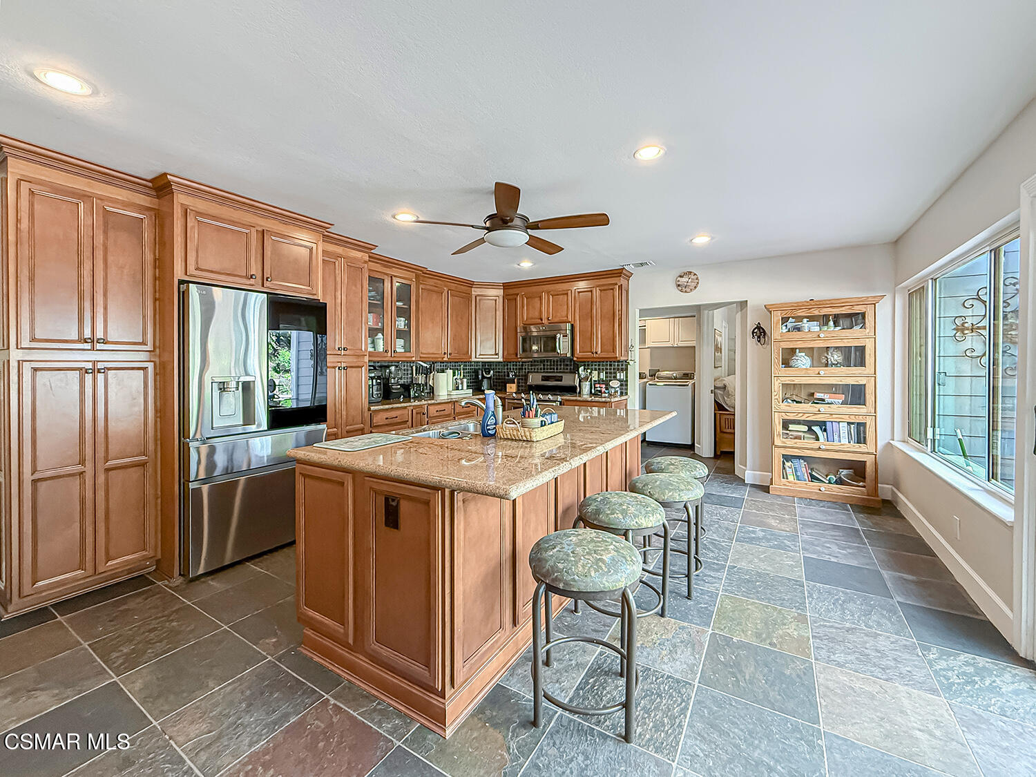 2189 Latham Street Simi Valley, CA 93065 - Photo 11 of 42 a kitchen with stainless steel appliances granite countertop a sink and a refrigerator