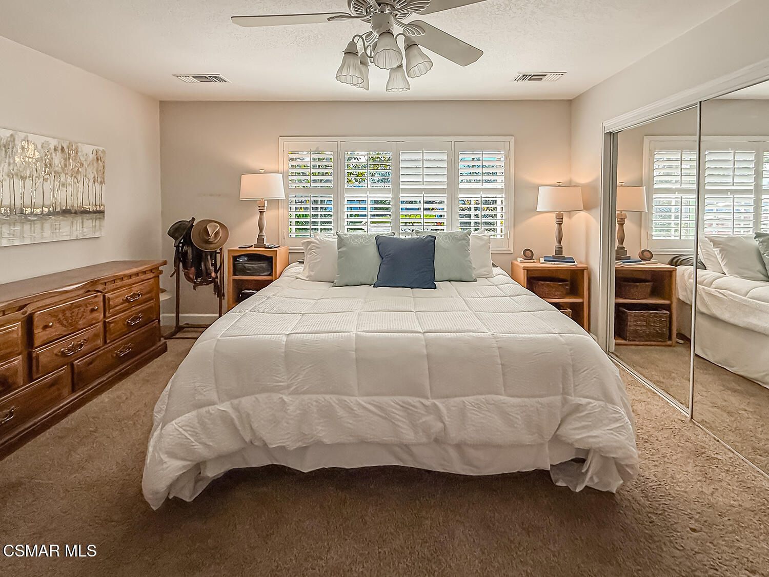 2189 Latham Street Simi Valley, CA 93065 - Photo 16 of 42 a bedroom with a large bed and a chandelier