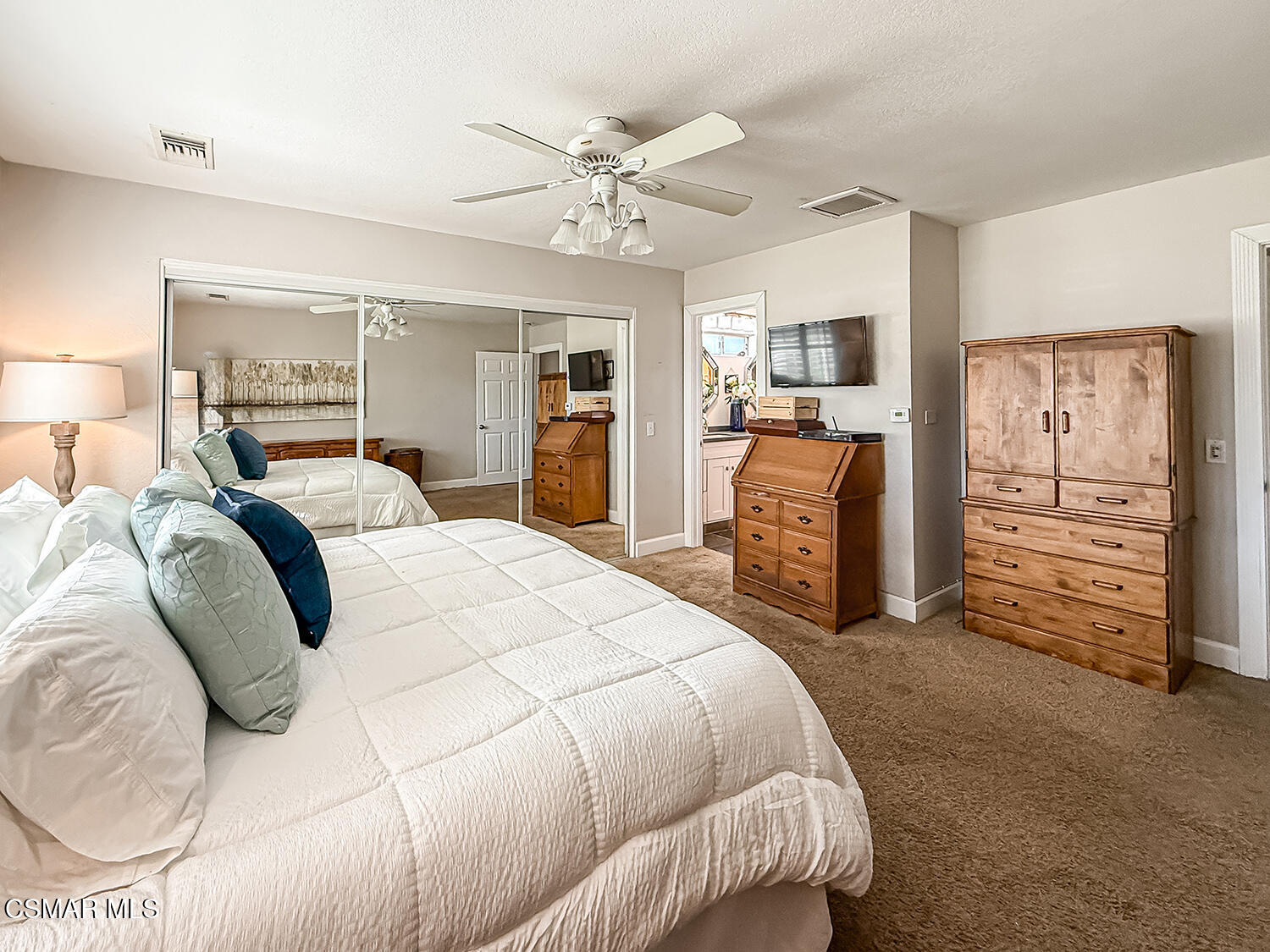 2189 Latham Street Simi Valley, CA 93065 - Photo 17 of 42 a bedroom with a bed and a chandelier