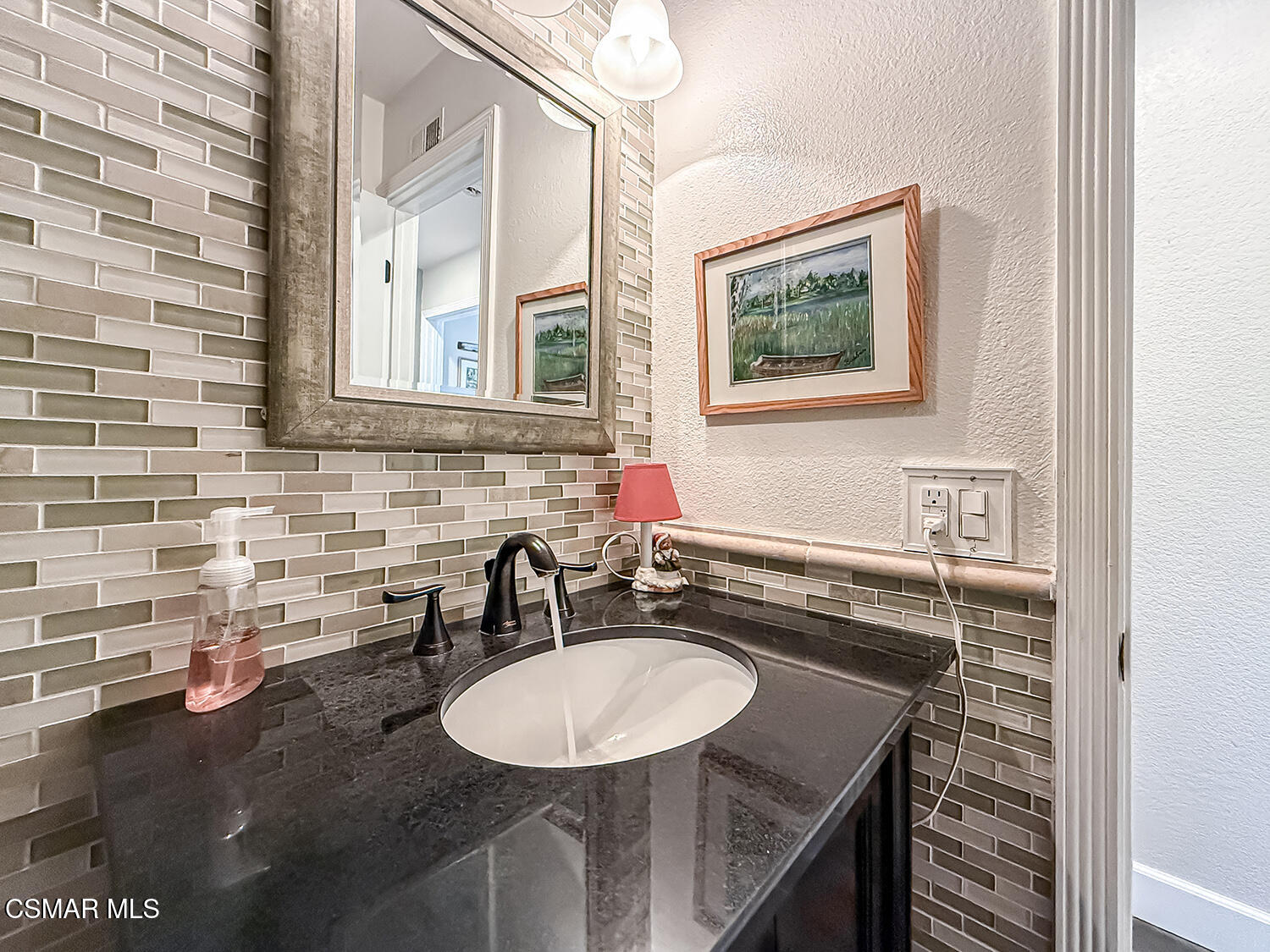 2189 Latham Street Simi Valley, CA 93065 - Photo 24 of 42 a bathroom with a sink and a mirror