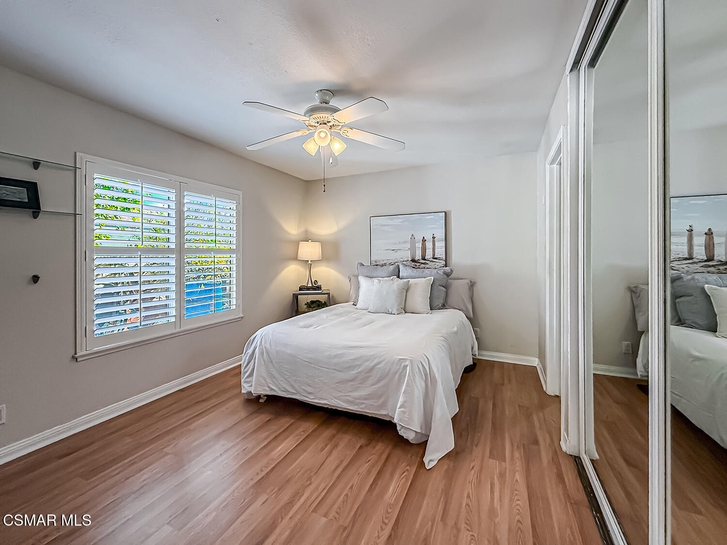 2189 Latham Street Simi Valley, CA 93065 - Photo 26 of 42 a bedroom with a large bed chandelier and a window