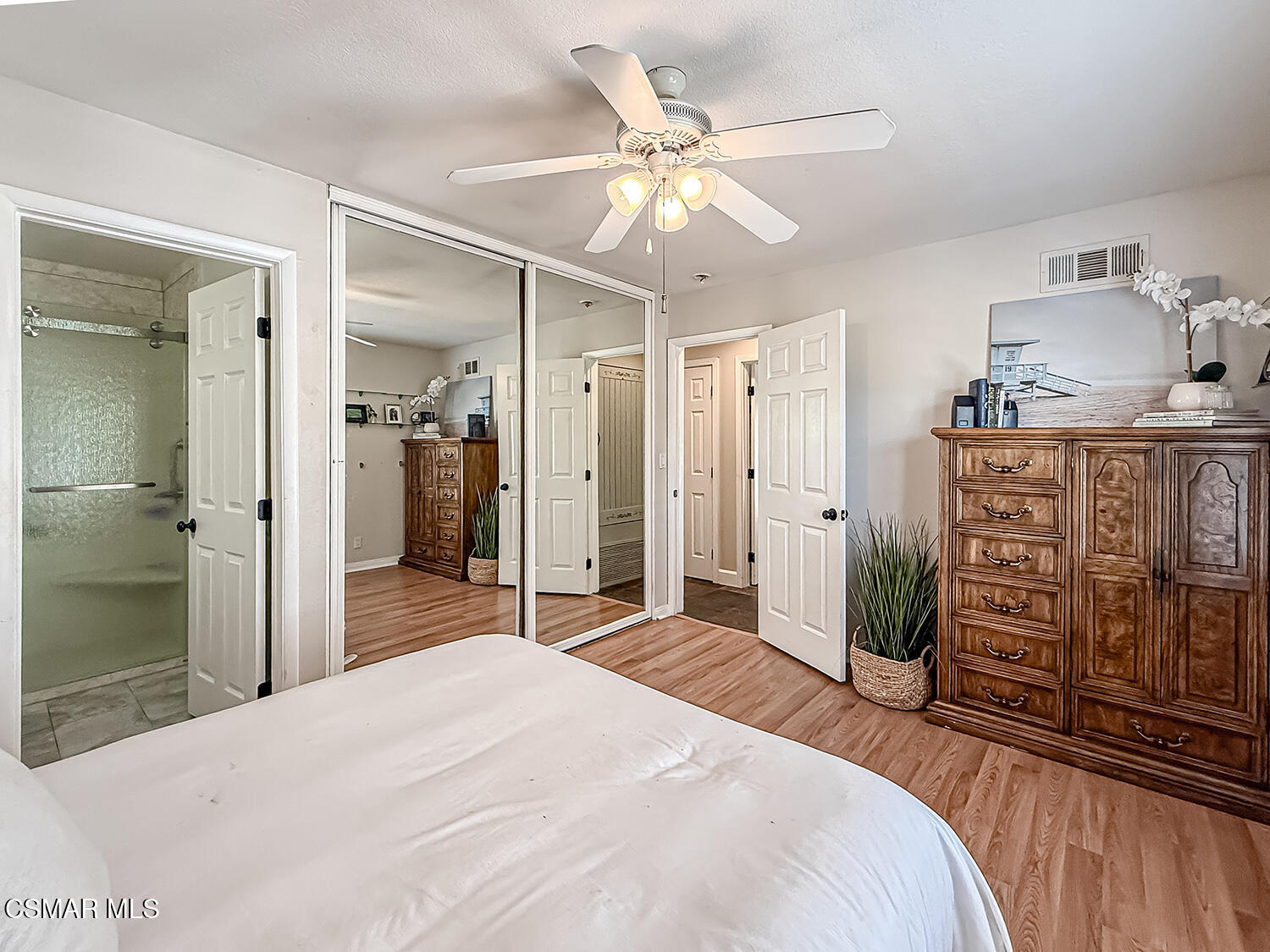 2189 Latham Street Simi Valley, CA 93065 - Photo 27 of 42 a bedroom with a bed and a chandelier