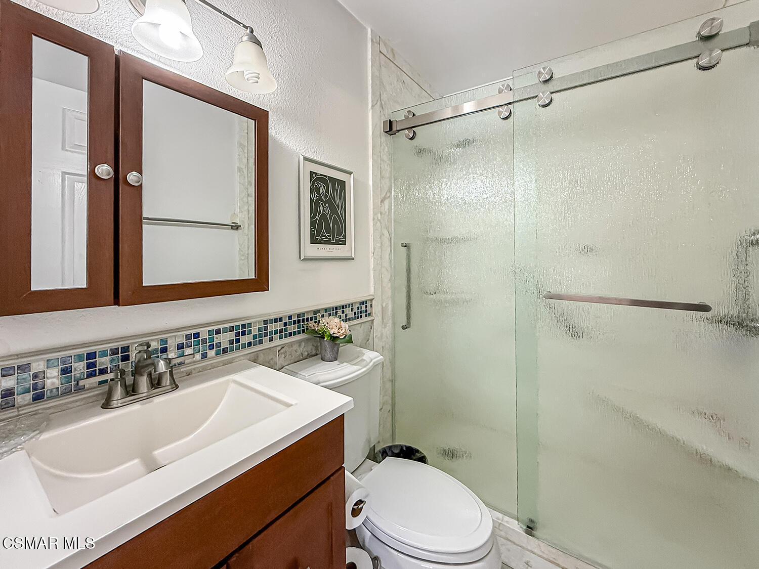 2189 Latham Street Simi Valley, CA 93065 - Photo 28 of 42 a bathroom with a sink toilet and shower