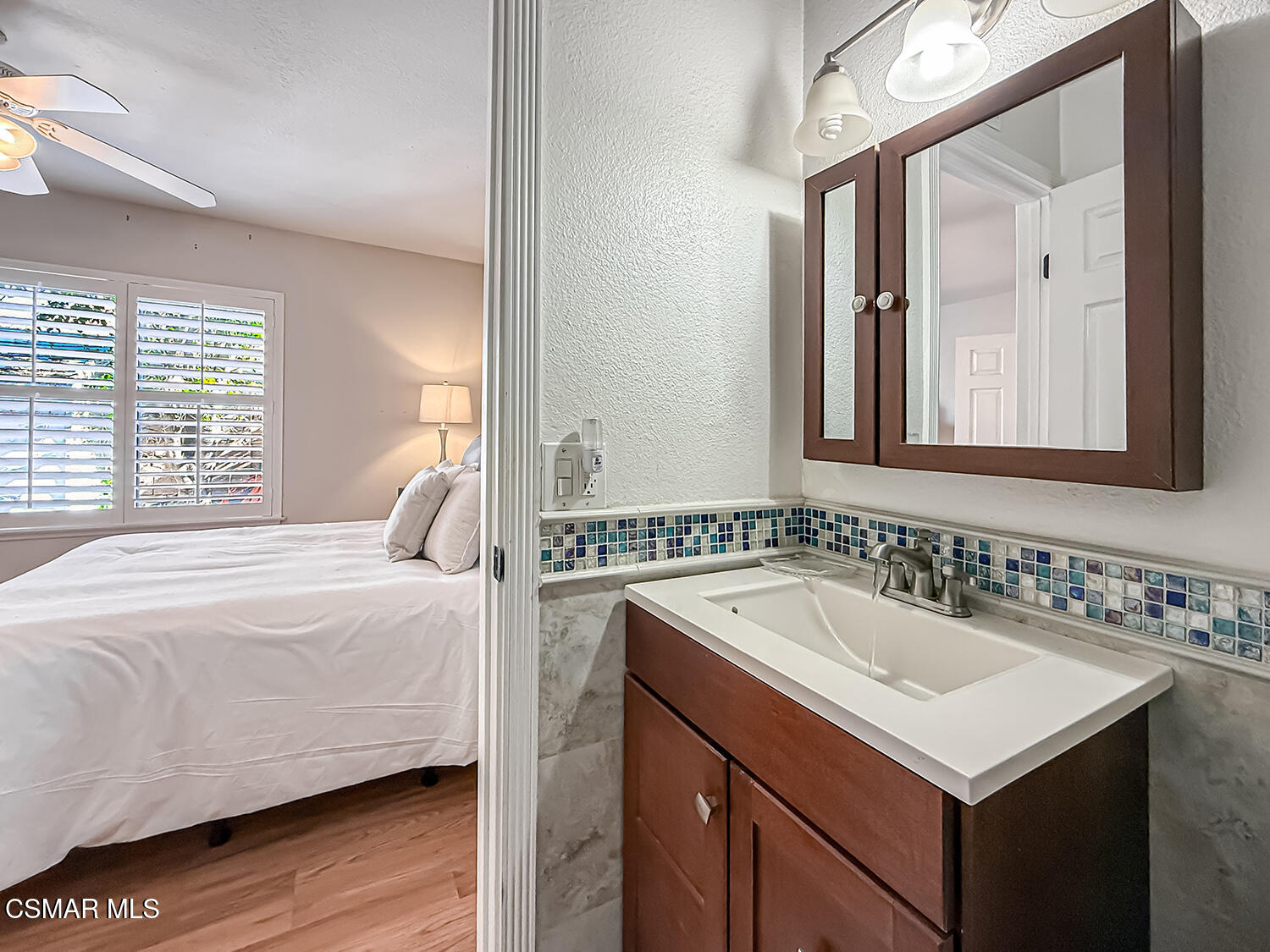 2189 Latham Street Simi Valley, CA 93065 - Photo 30 of 42 a bedroom with a sink and a mirror