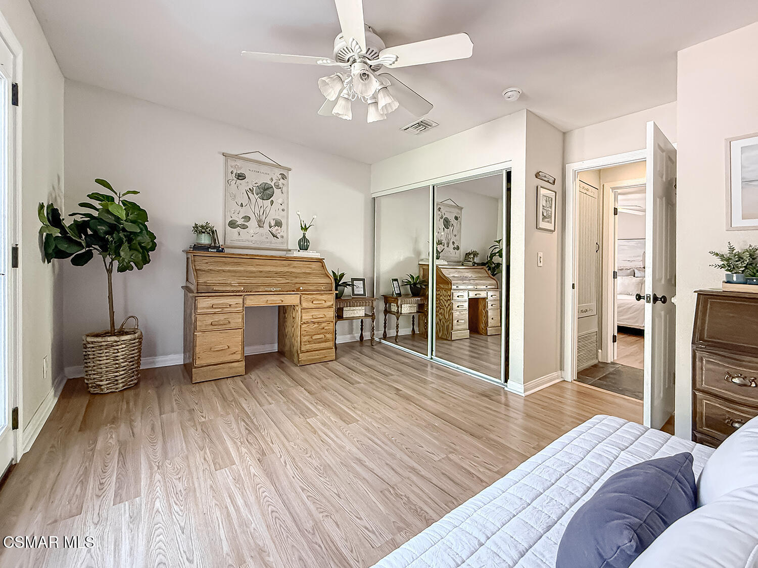 2189 Latham Street Simi Valley, CA 93065 - Photo 33 of 42 a spacious bedroom with a bed and a chandelier