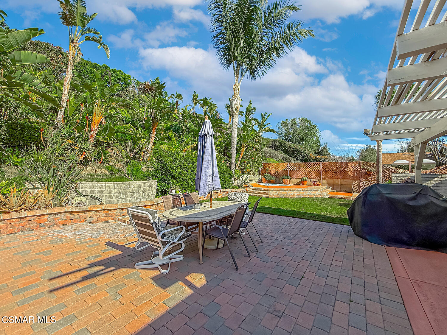 2189 Latham Street Simi Valley, CA 93065 - Photo 37 of 42 a view of a backyard with a garden and seating area