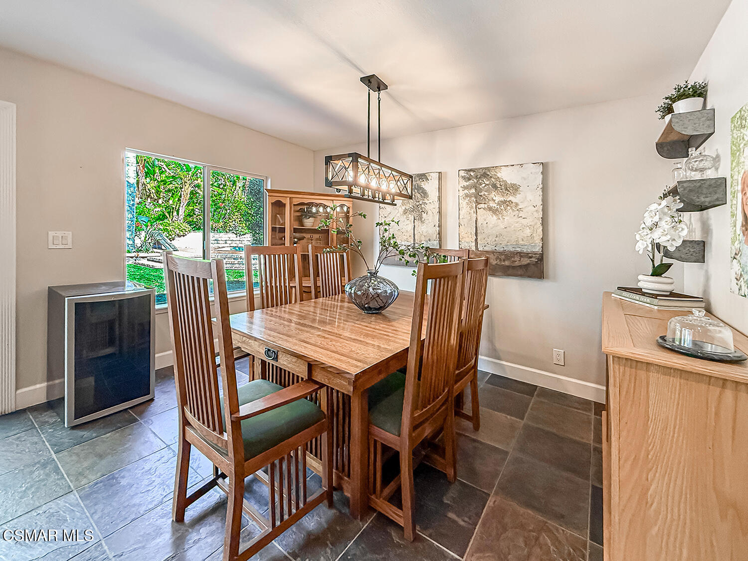 2189 Latham Street Simi Valley, CA 93065 - Photo 10 of 42 a dining room with furniture a chandelier and wooden floor