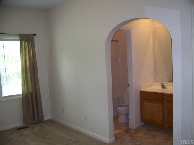 2517 Ferndown Court Raleigh, NC 27603 - Photo 7 of 10 a view of a bathroom with a sink and a toilet
