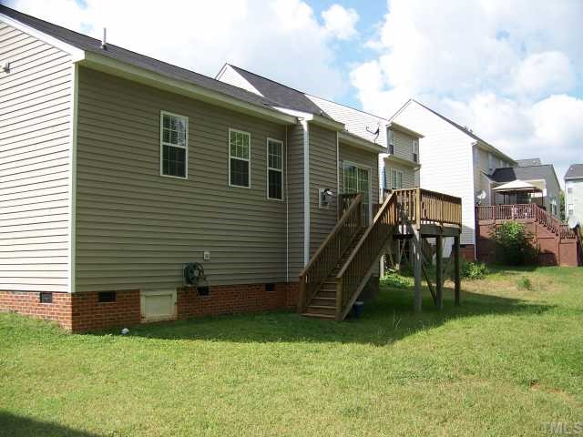2517 Ferndown Court Raleigh, NC 27603 - Photo 9 of 10 a view of a house with a yard