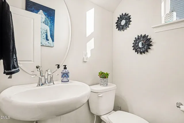 a bed sitting in a room next to a window