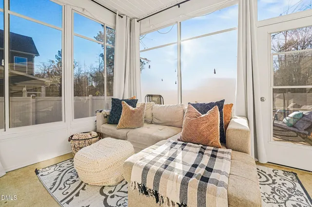 a view of a white house with a large windows