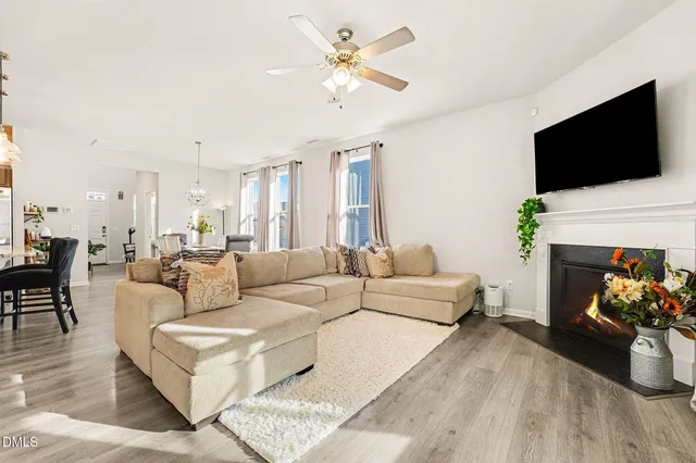 a living room with furniture fireplace and a flat screen tv