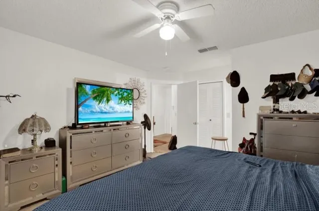 a bedroom with furniture and natural light