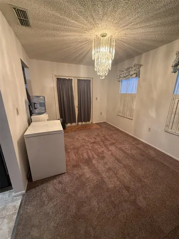 a view of a room with a washer and dryer